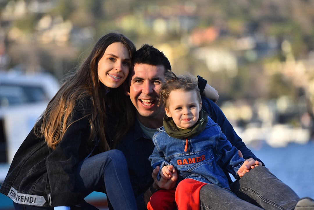 Happy couple relaxing together in bed at home, cozy morning lifestyle moment.