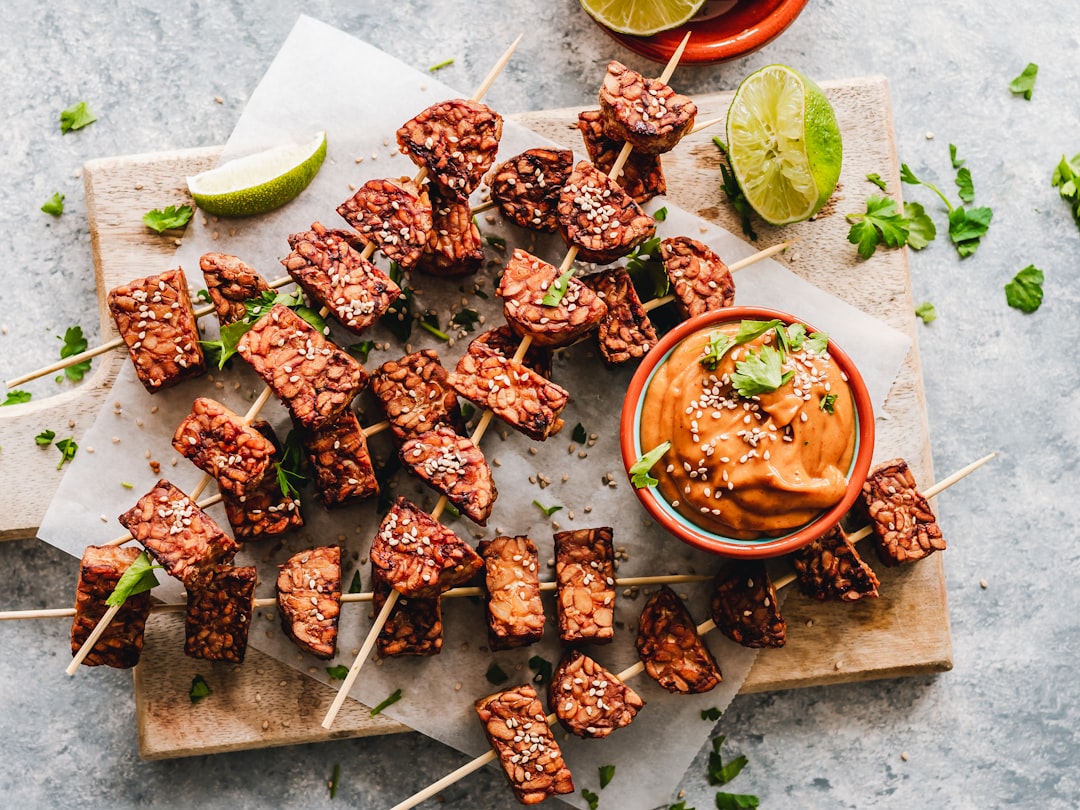 Sesame tempeh skewers with spicy peanut sauce.